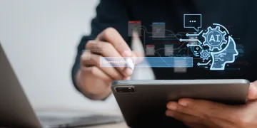 person holding a tablet with graphic overlay showing AI and computing pathways