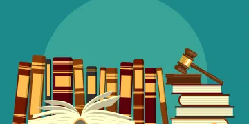 Books on bookshelf with gavel