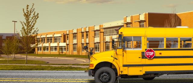 School with bus in front