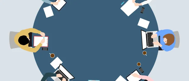 table with people around it 