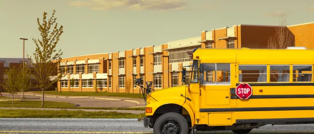 School with bus in front