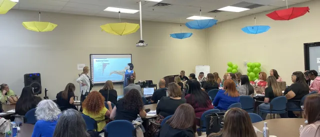 Group of educators looking at screen